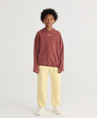 Boy in Bobo Choses Jogging Pants - Yellow | Bobo Choses