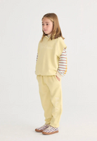 Side view of girl wearing Bobo Choses Sleeveless Hoodie - Yellow | Bobo Choses