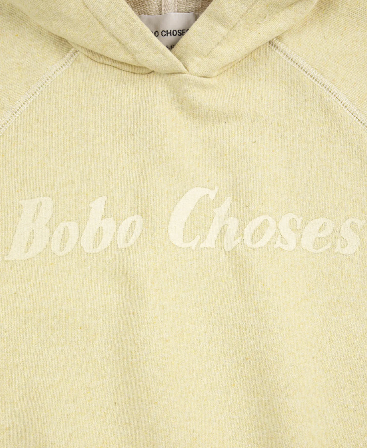 Close up of text on the Bobo Choses Sleeveless Hoodie - Yellow | Bobo Choses