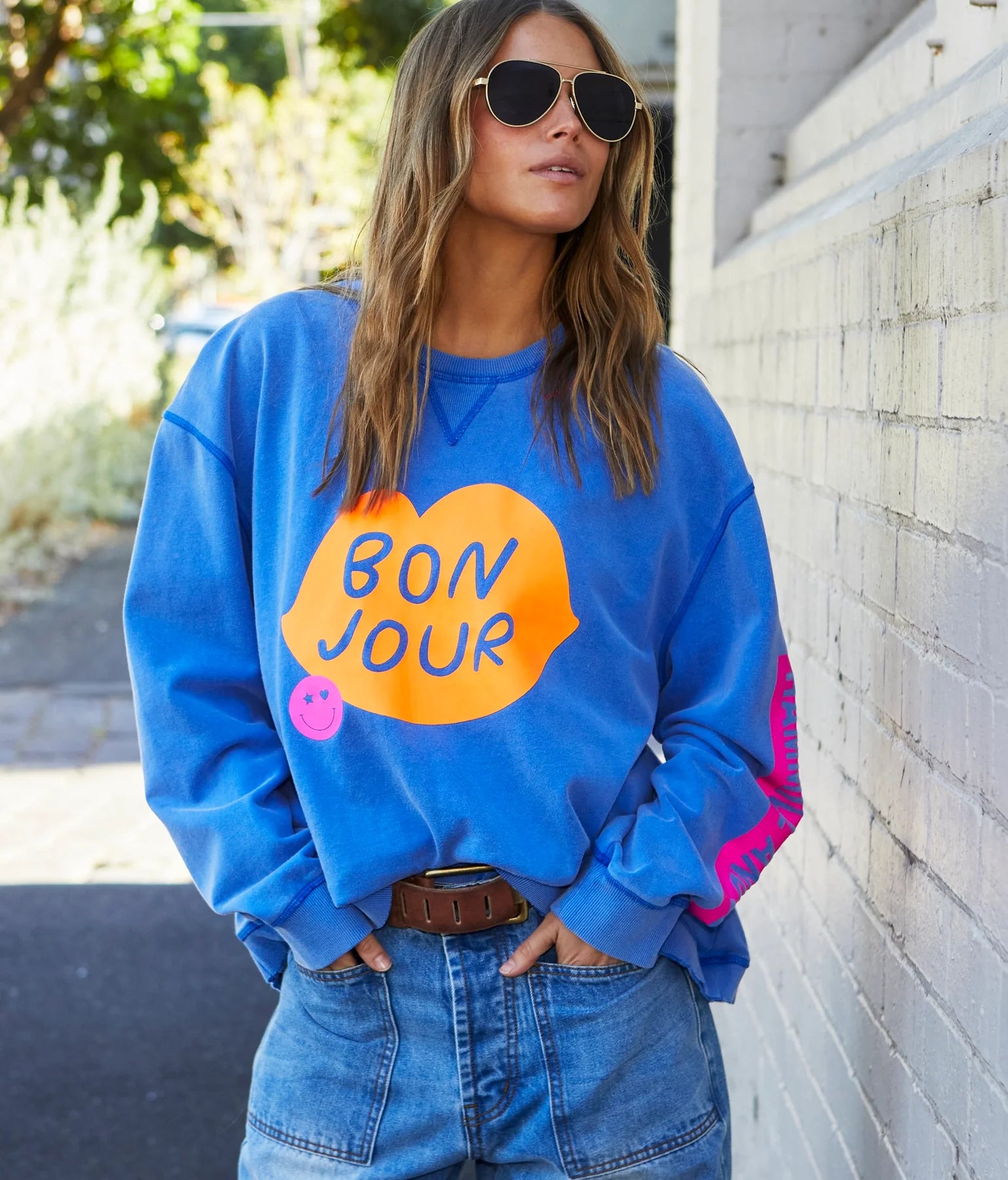 model wearing Bonjour washed blue sweater by Hammill & Co