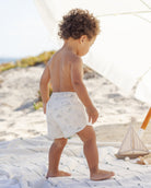 Back view of toddler wearing the Boys Swim Short Dinosaur | Quincy Mae