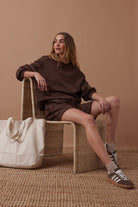 model wearing brown jumper - Ruby Reverse Panel Crew Chocolate Ceres Life
