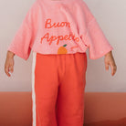 Girl in the Buon Appetito T-shirt - Pink Icing | Golden Children