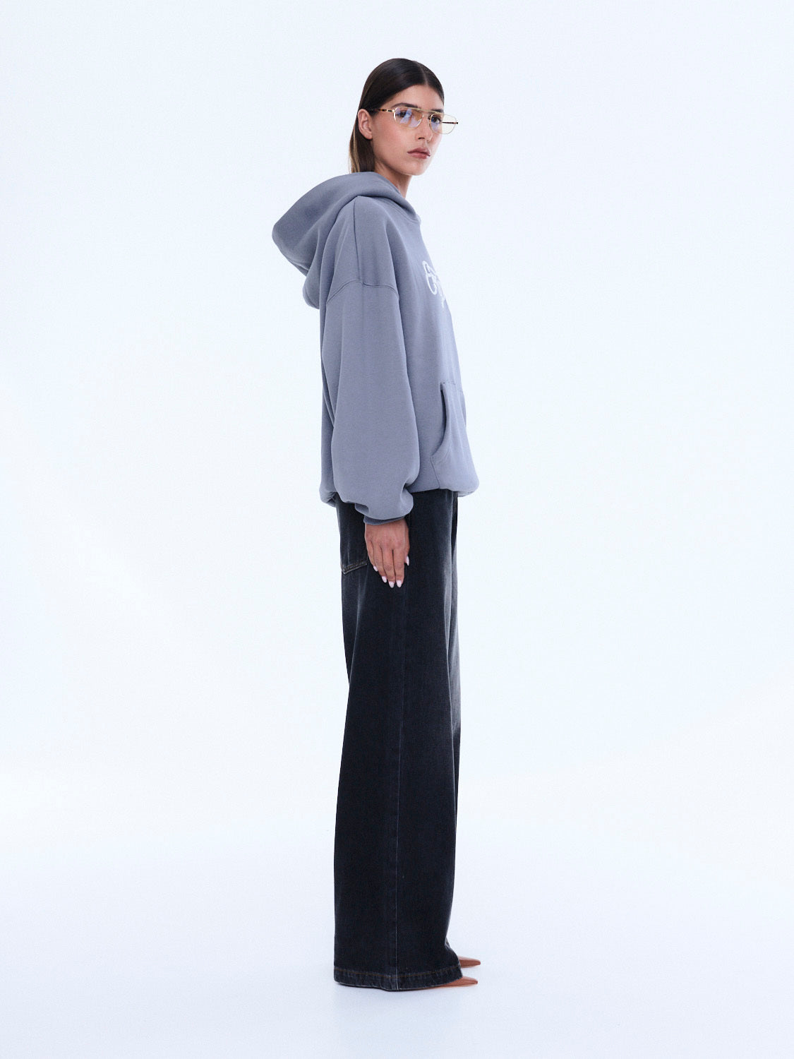 Side view of gray Cassie Oversized Hoodie showing relaxed fit and oversized silhouette