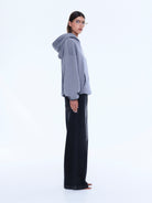 Side view of gray Cassie Oversized Hoodie showing relaxed fit and oversized silhouette