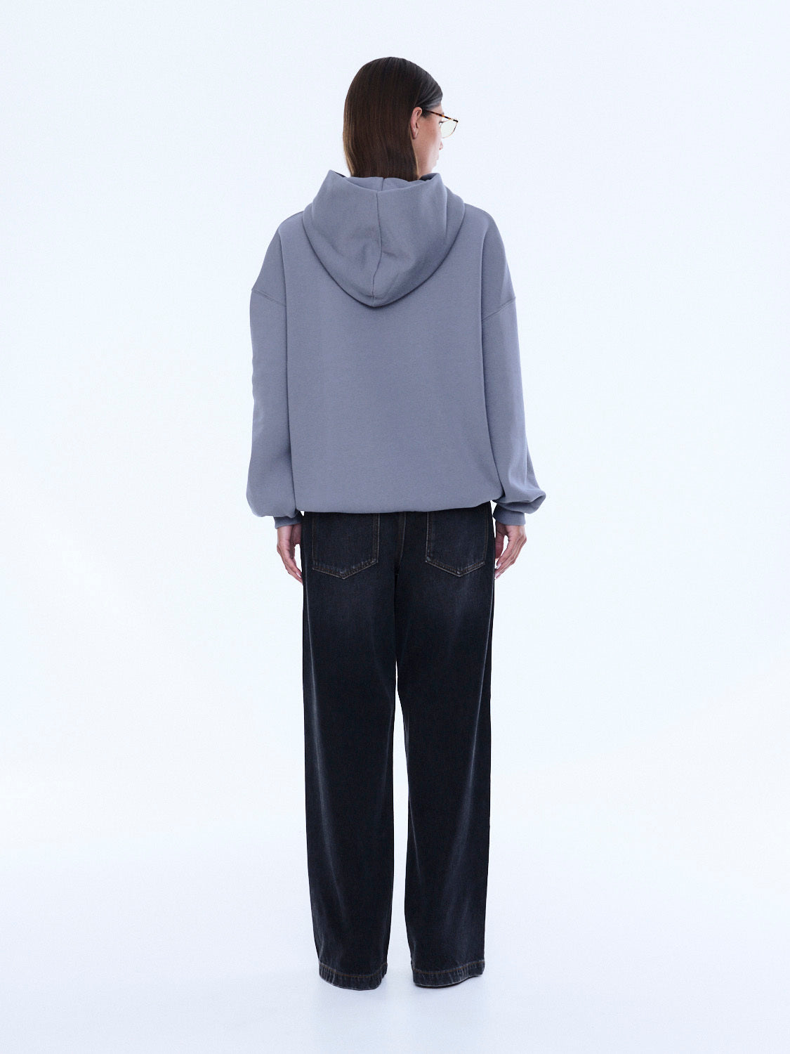 Back view of Cassie Oversized Hoodie displaying gray color and hood construction
