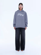 Full length view of Cassie Oversized Hoodie in gray showing relaxed oversized fit