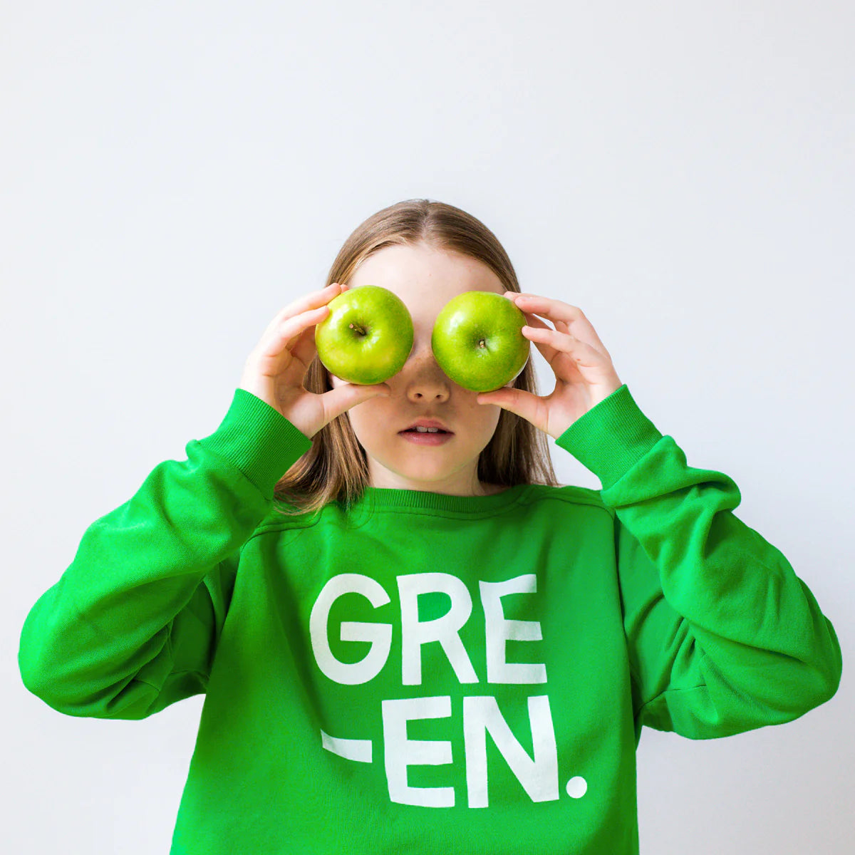 Green in white print on green sweater