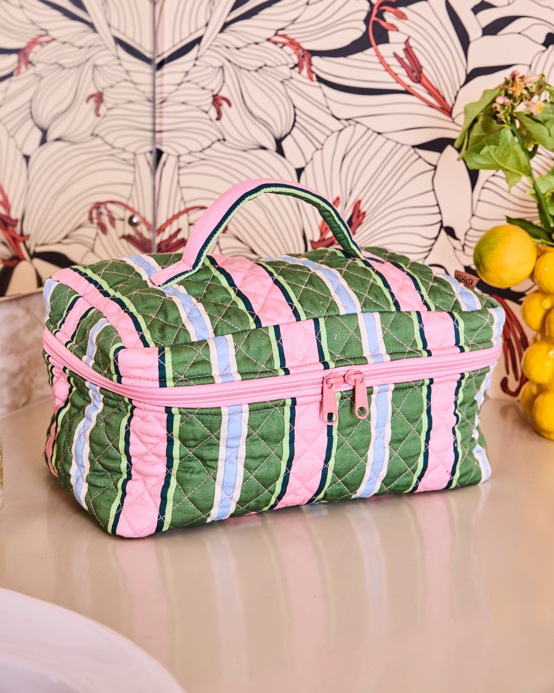 Kip & Co Cactus Stripe Quilted Cotton Toiletry Case front view with pink green blue striped pattern and pink zipper