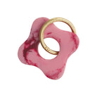Pink marble resin flower-shaped keyring with gold carabiner ring on white background