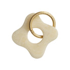 Cream ivory marble resin flower-shaped keyring with gold carabiner ring on white background