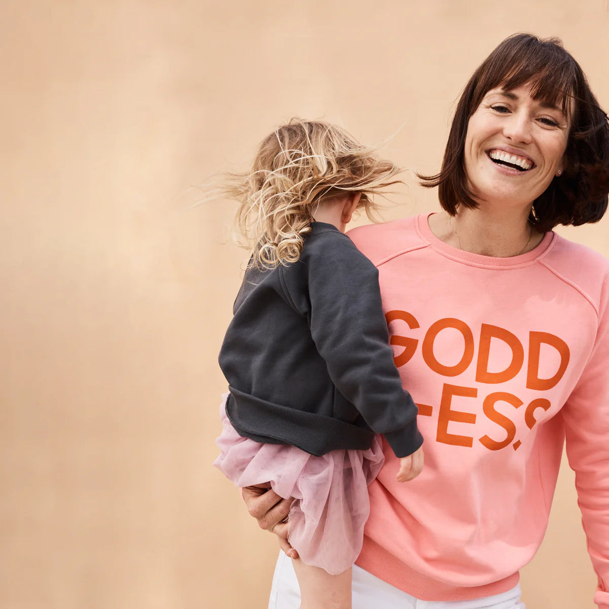 Goddess Sweater Pink with red writing