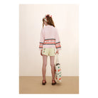 girl wearing pink Cherries Sweater by Tiny Cottons