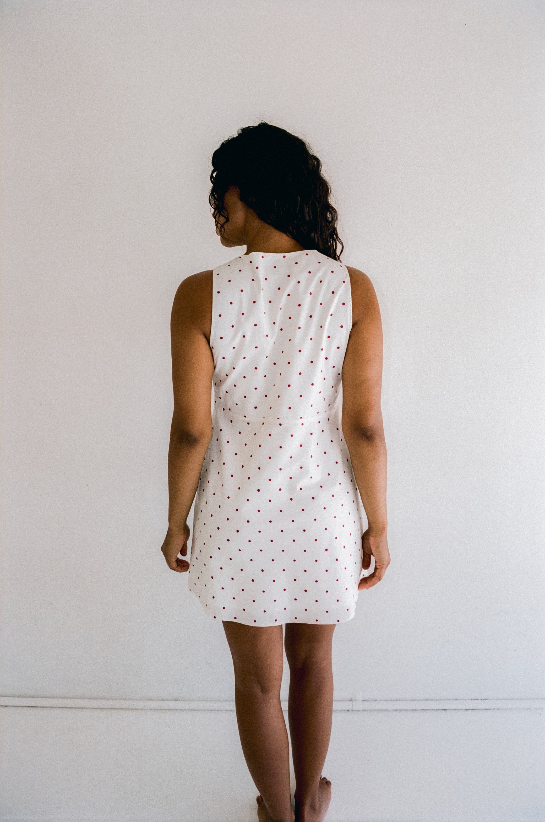 back view of Clara Mini Dress – Cherry Polka Dot by Juni