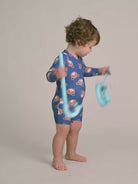 Child side view wearing Classic Hux Rashie | Huxbaby