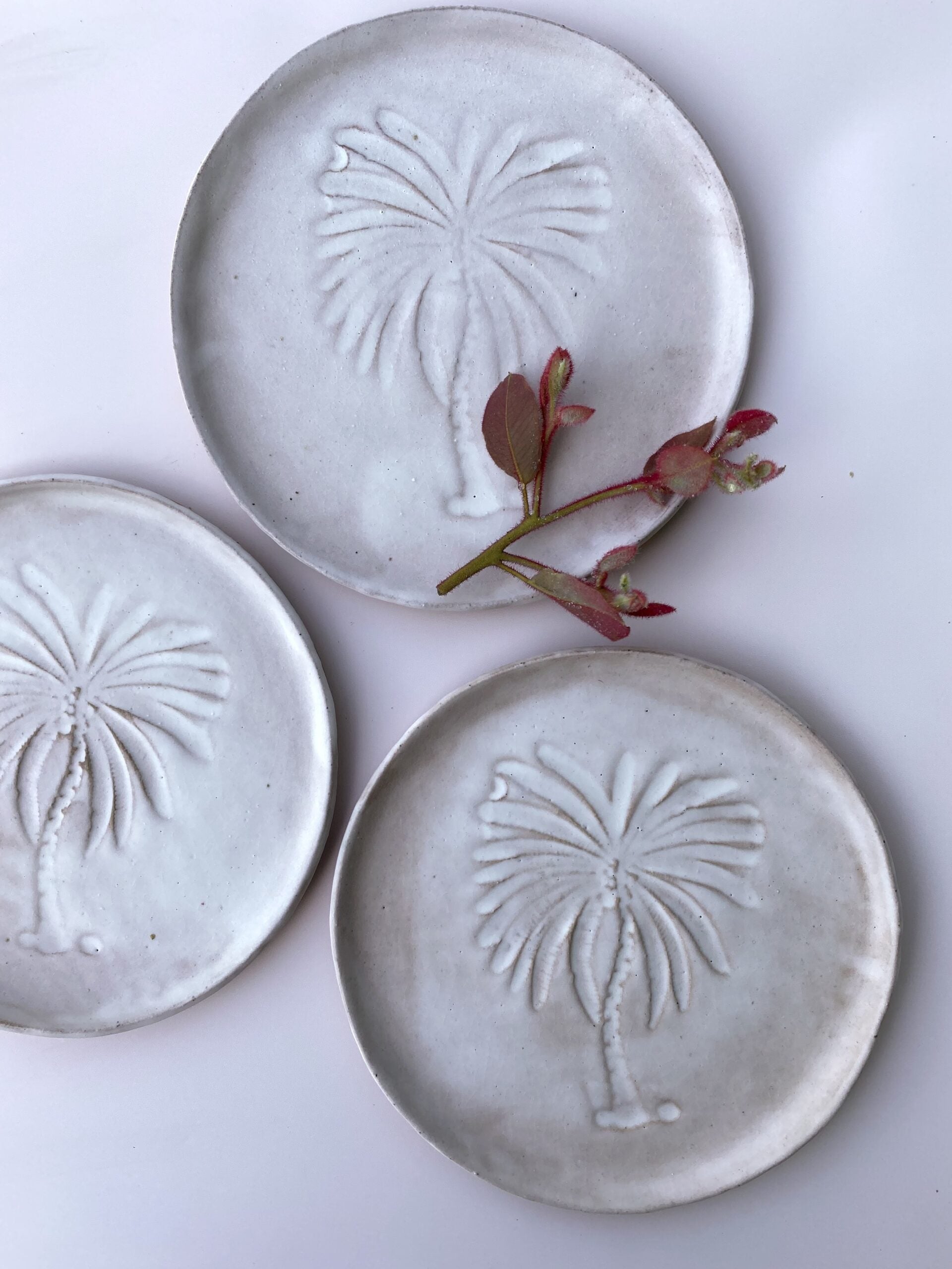 Round trinket plate with palm tree by Clay Society