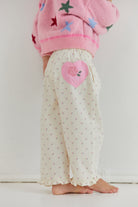 Back view detail of Cleo Pant showing pink heart patch and elastic waistband