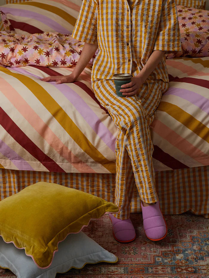  lady wearing Cloud Slipper in Orchid by Mosey Me 