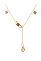 Back of gold clover charm necklace by Fairley