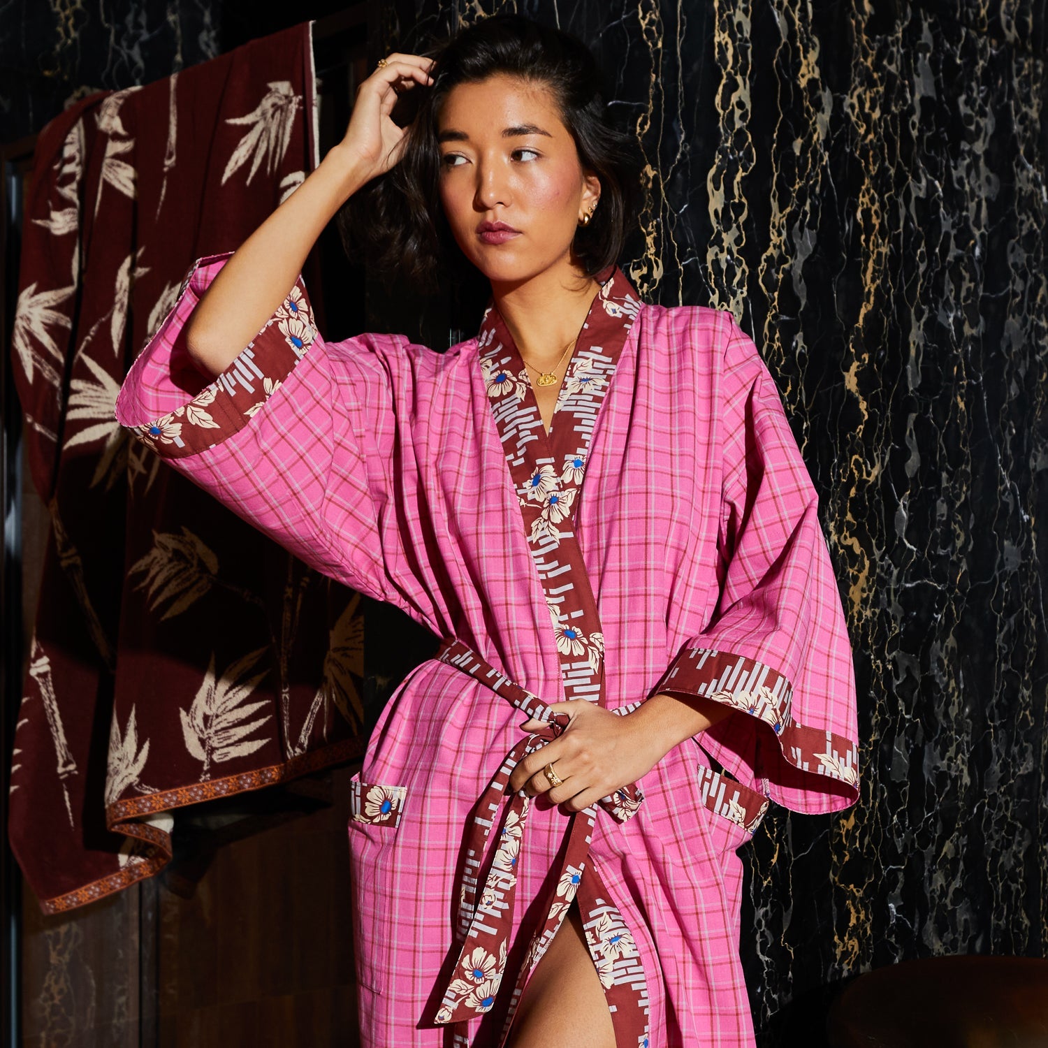 Close-up view of Cosmin Cotton Robe showing wide bell sleeves and floral maximalist trim detailing by Sage & Clare