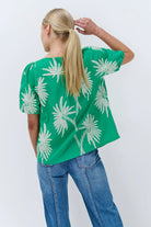 Green top with white palm tree embroidery by Kireina