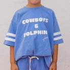 Close up of the Cowboys & Dolphins T-shirt - Pool Blue | Golden Children
