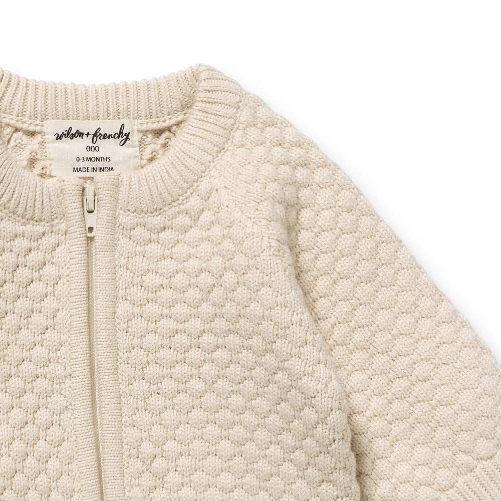 Close up of fabric on the Cream Organic Knitted Bauble Growsuit | Wilson + Frenchy
