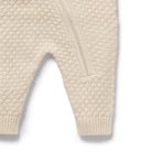 Leg area close up of the Cream Organic Knitted Bauble Growsuit | Wilson + Frenchy
