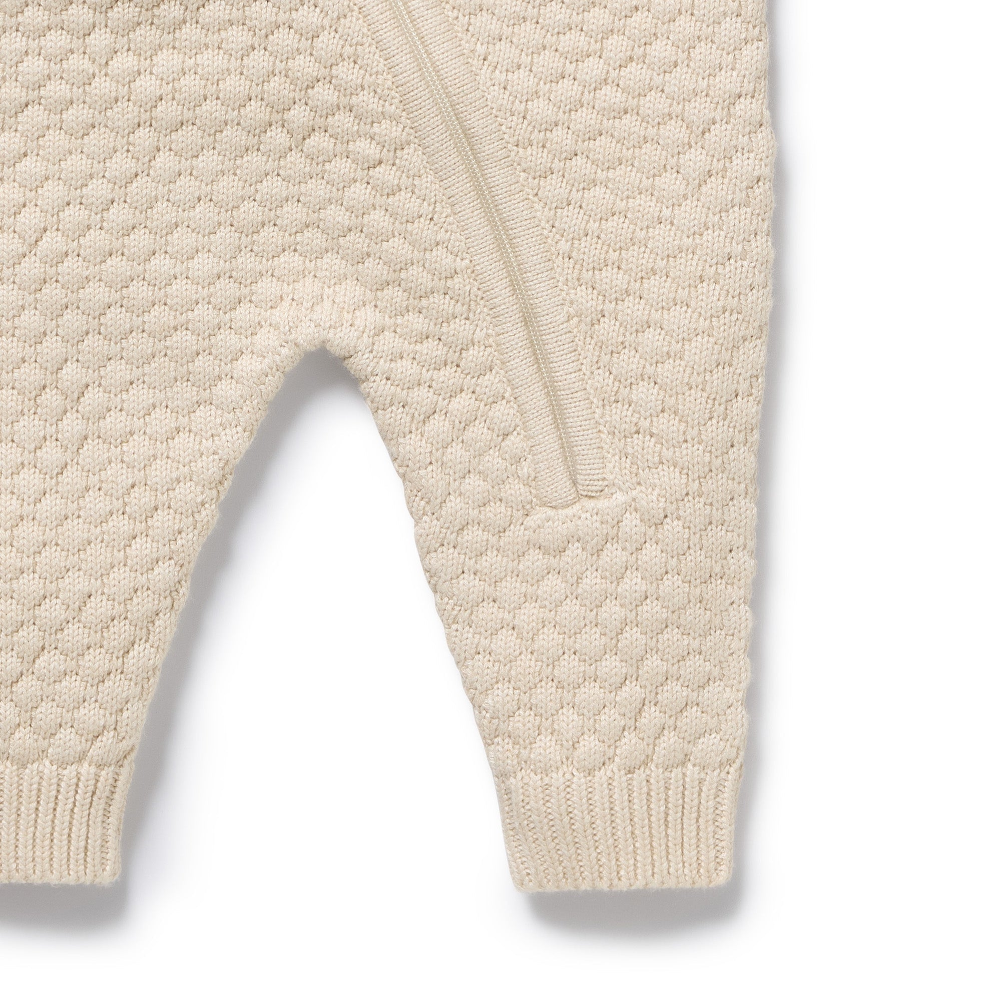 Leg area close up of the Cream Organic Knitted Bauble Growsuit | Wilson + Frenchy