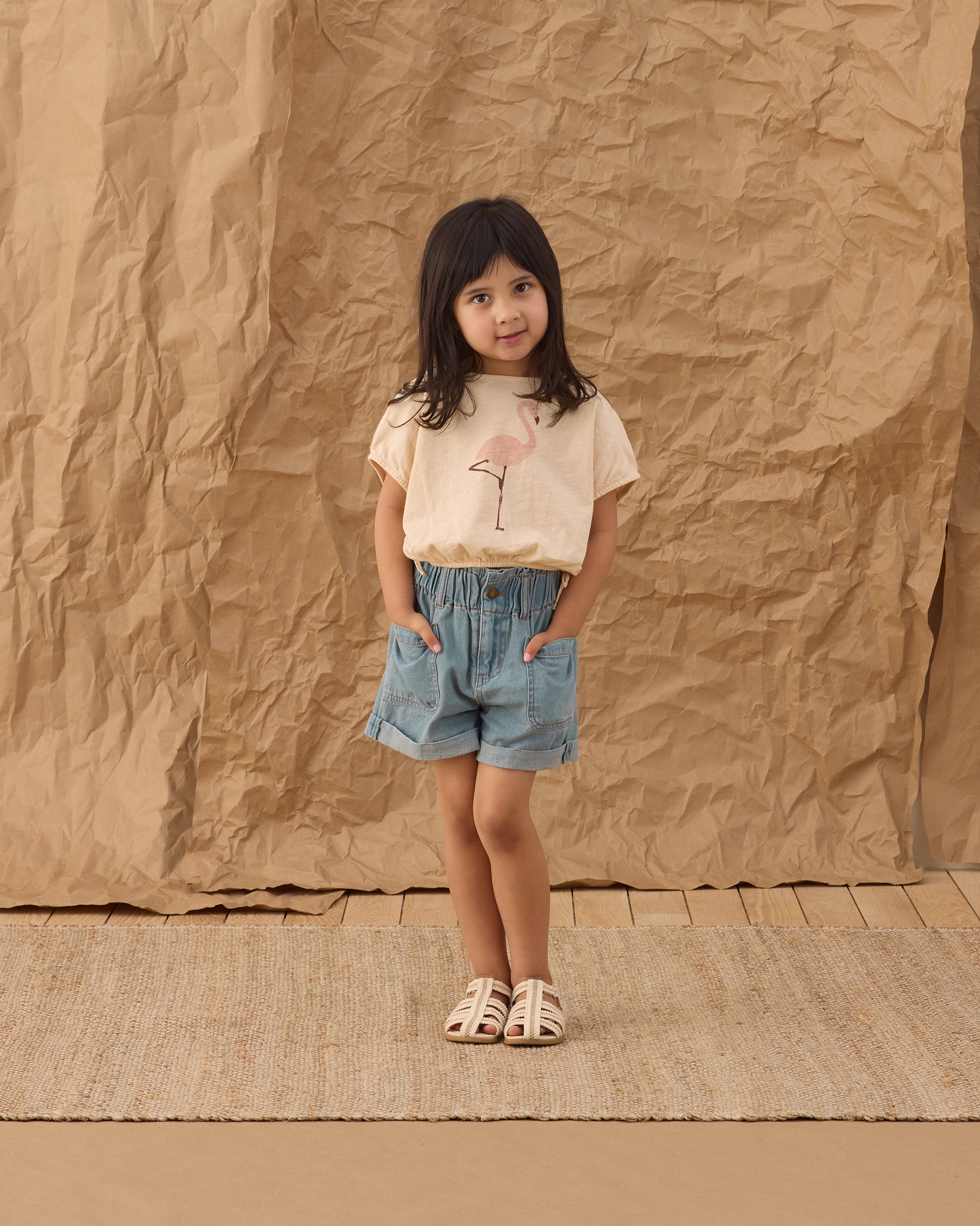 Front view of young girl in the Cropped Cinch Tee Flamingo | Rylee +Cru