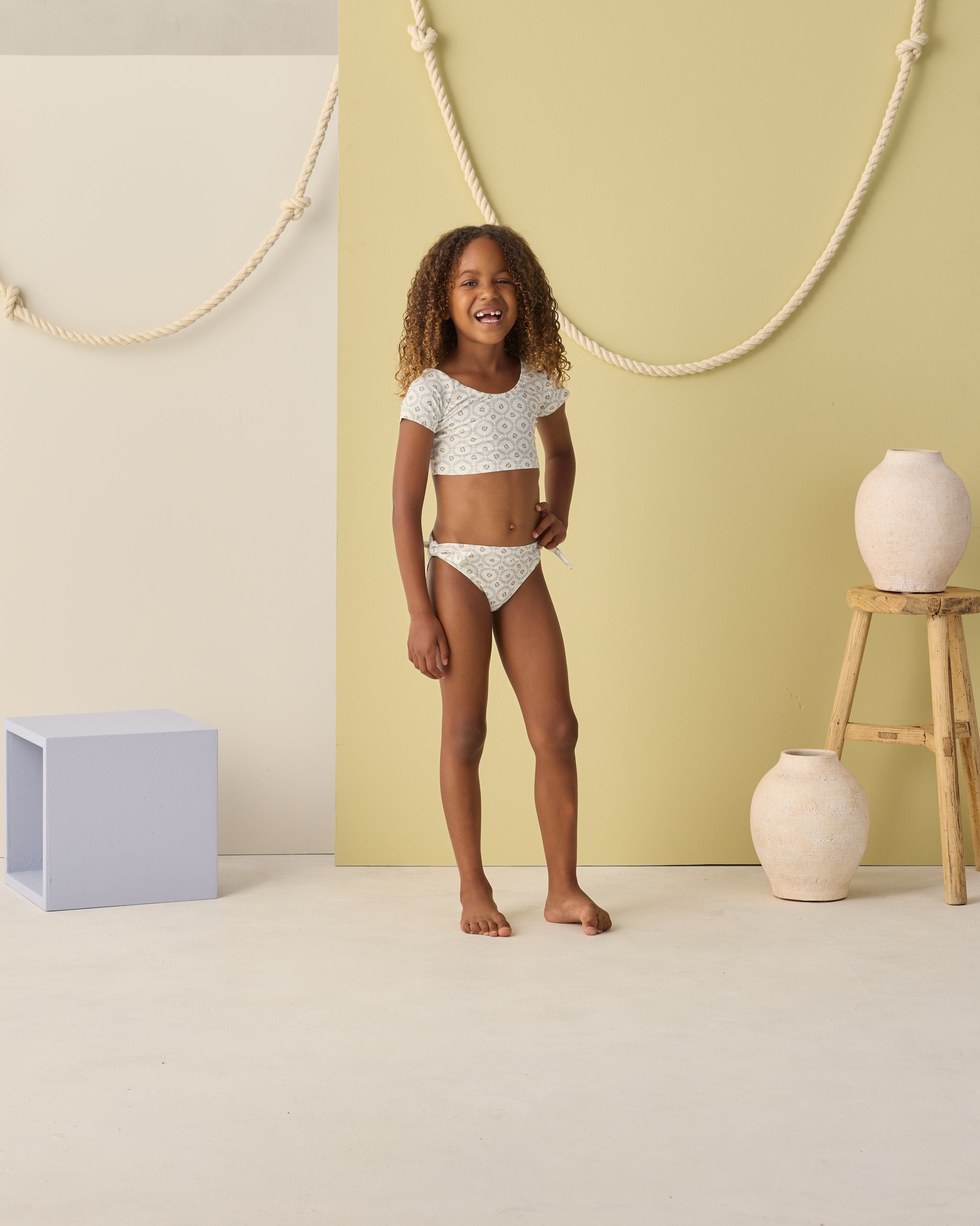 Girl wearing Cropped Rashguard Set Green Fleur | Rylee + Cru