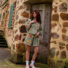 Full body view of model in Dahlia shirt with matching shorts showcasing complete set styling