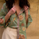 Close-up detail of Dahlia shirt contrast placket with vintage chain-inspired watercolor motif
