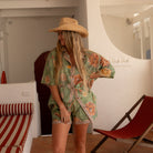 Model wearing Dahlia Moss shirt with cowboy hat showing versatile styling options and relaxed fit