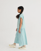 Side view of the Daisy Mosaic All Over Woven Culotte Pants - Light Blue | Bobo Choses