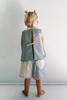 Della Short - blue check by JUNI - with pink scalloped edges