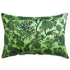 Green pillow with black floral pattern on a white background