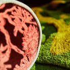 corner detail of Delphine Velvet Bolster Cushion by Sage & Clare