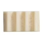 Top-down view of the Pearl soap dish showing its ribbed underside in creamy white marbled resin
