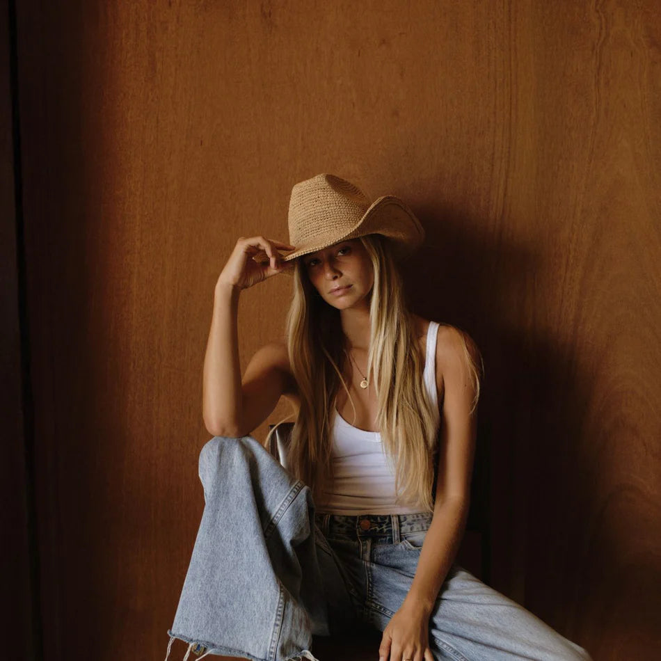 lady wearing Duke Straw Raffia Cowboy Hat by Will & Bear