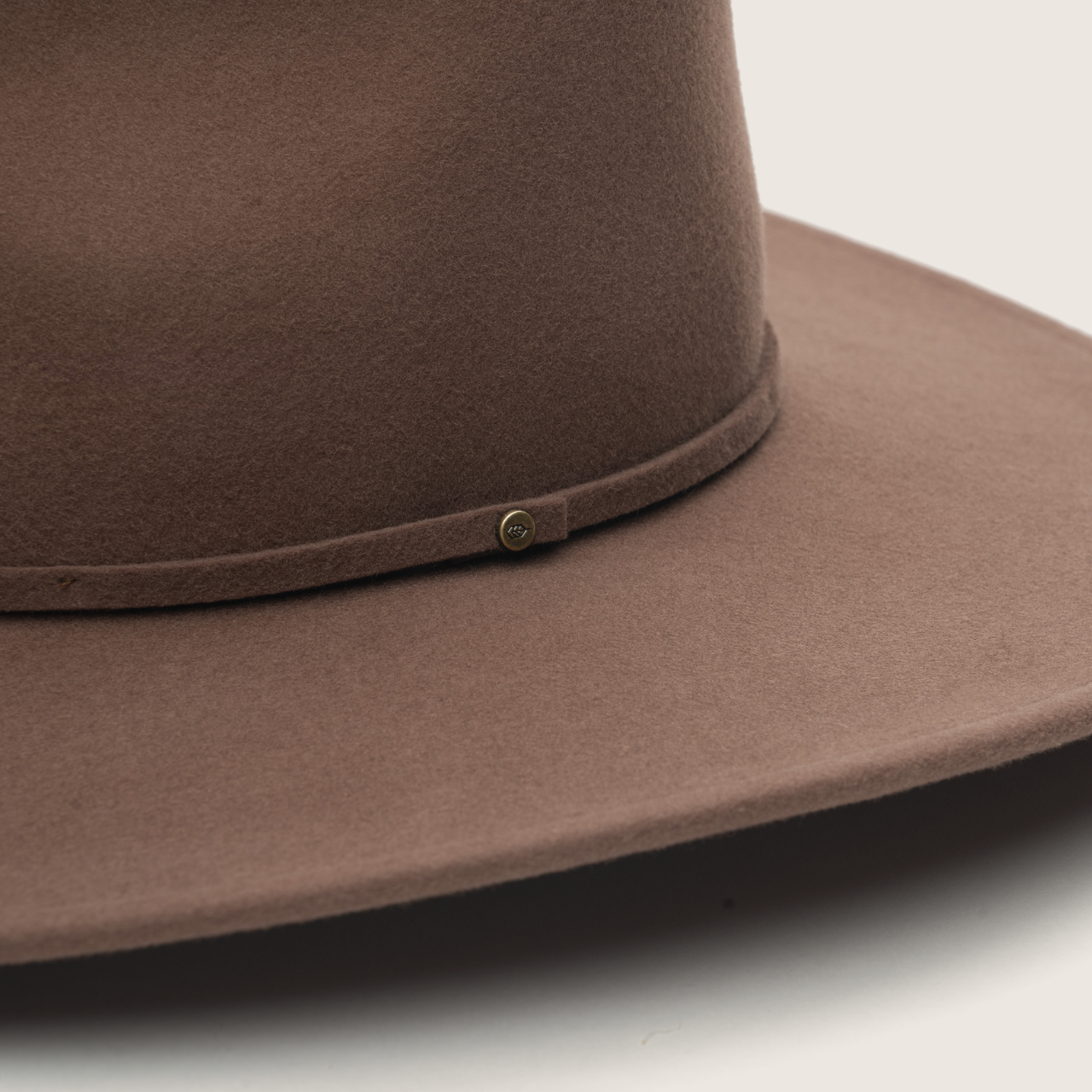 Dusty brown packable outback hats worn by two models in outdoor adventure lifestyle setting