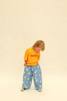 Front view of Dusty Star Pants showing relaxed fit and all-over star pattern in cobalt blue