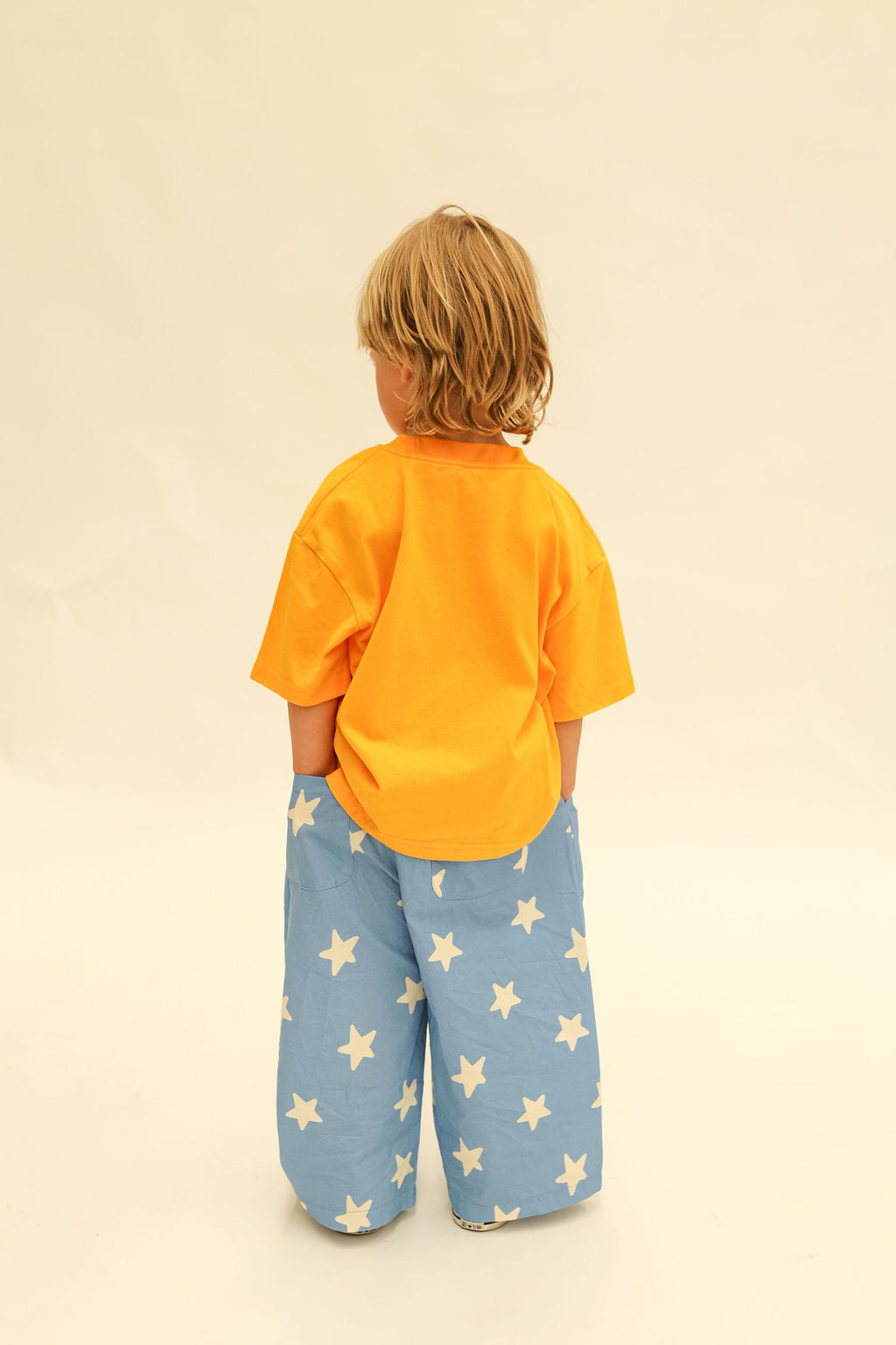 Back view of Dusty Star Pants displaying wide leg cut and scattered star print design