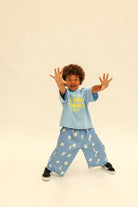 Front view of Dusty Star Pants showing comfortable fit and playful star pattern details