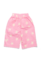 Movement shot of Dusty Star Pants in pink showing flowing wide-leg silhouette with star print