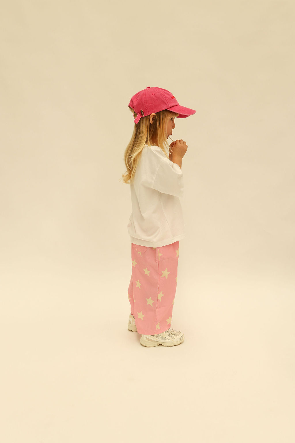 Back view of pink Dusty Star Pants showing star print pattern and wide-leg silhouette
