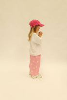 Back view of pink Dusty Star Pants showing star print pattern and wide-leg silhouette