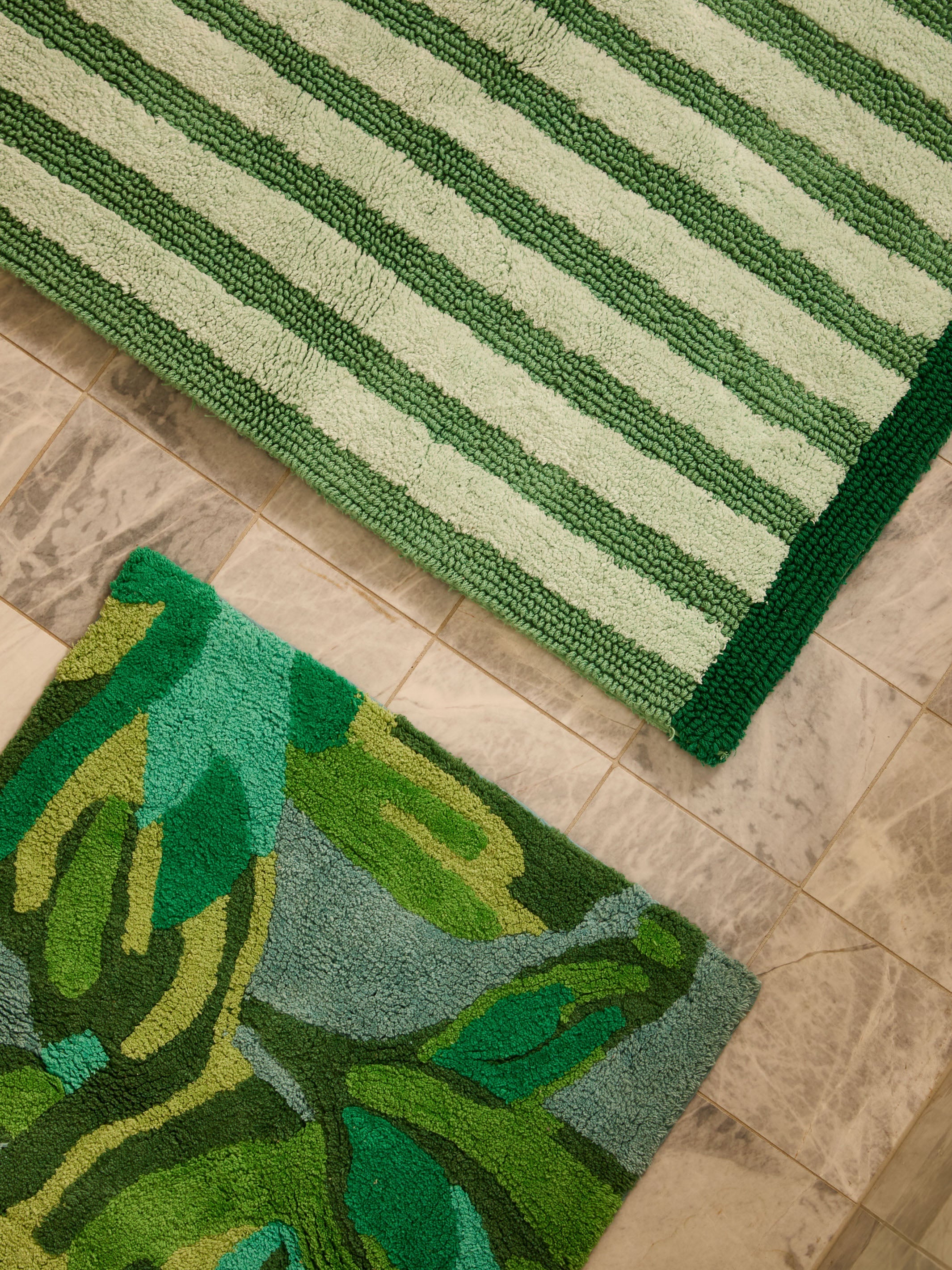 Close-up detail showing hand tufted cotton texture and floral pattern on Dutch Floral Green Bath Mat