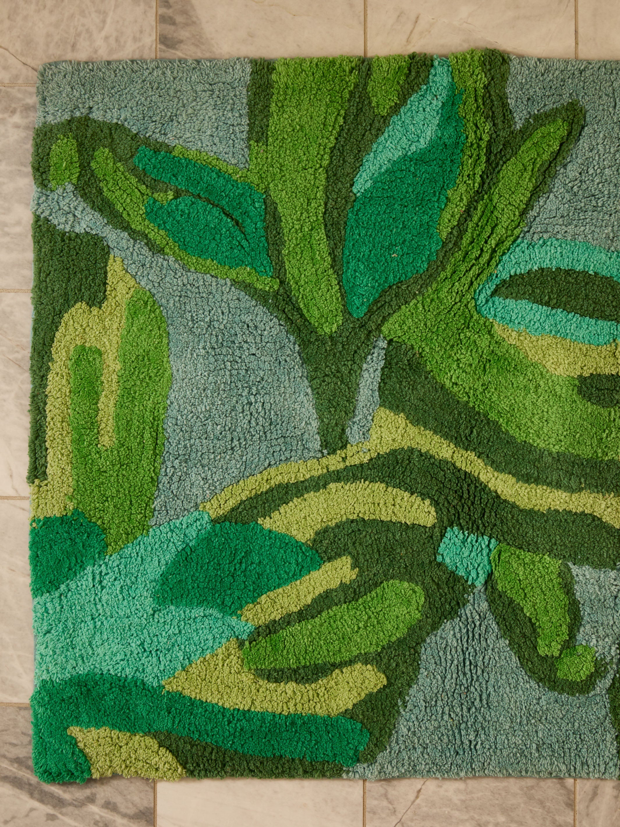 Overhead view of Dutch Floral Green Bath Mat showing complete tulip and leaf pattern design
