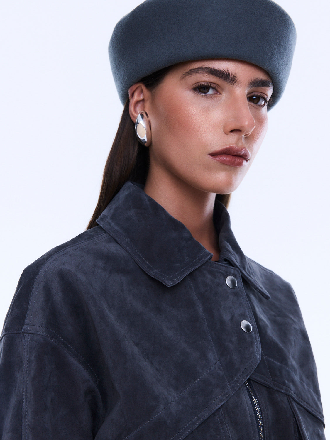 Close-up of Emma Utility Suede Jacket showing navy suede texture and silver snap button details on collar